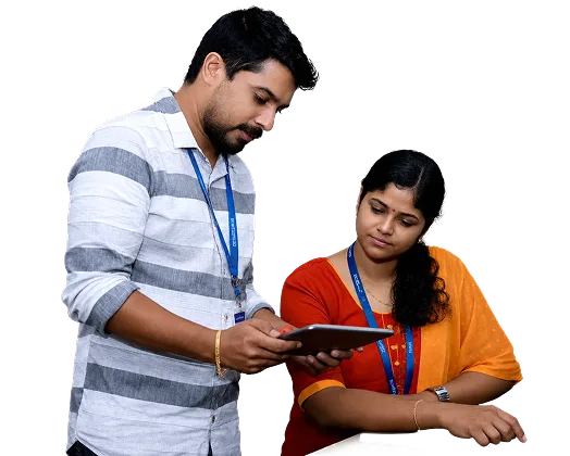 A Ucartz team member mentoring a colleague at her desk